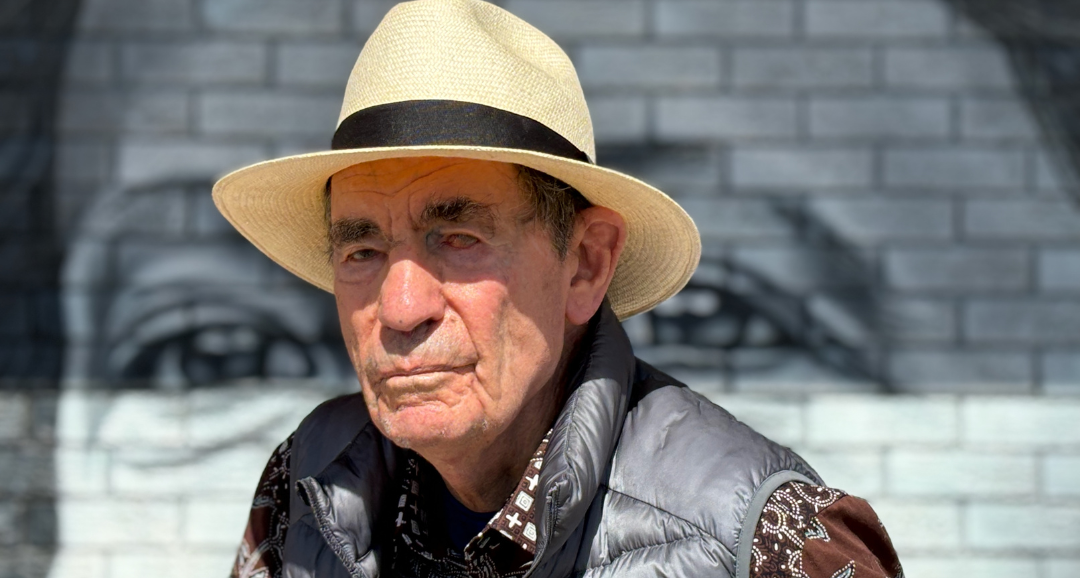 Albie Sachs in front of the Dulcie September mural at Athlone Centre_Photo ©Carolyn Partonpng